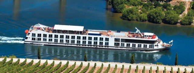Uniworld's Douro Spirit sails through Portugal's breathtaking Douro River Valley in 2012. This year, a brand-new ship takes over the reigns. Photo courtesy of Uniworld. 