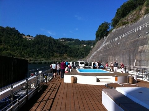 Douro Spirit emerging into the sunlight after transiting a lock. Note the swimming pool - a great place to cool down! Photo © 2012 Peter Saunders