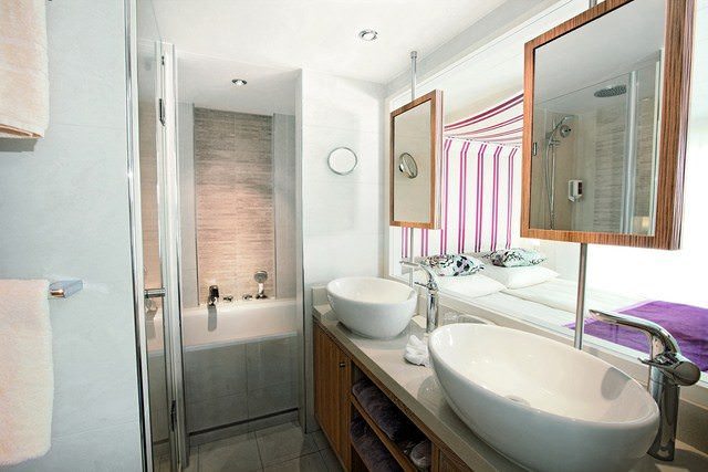 A-ROSA SILVA features two separate suite categories that include amenities like a spacious, dual-vanity bathroom. Photo courtesy of A-ROSA.