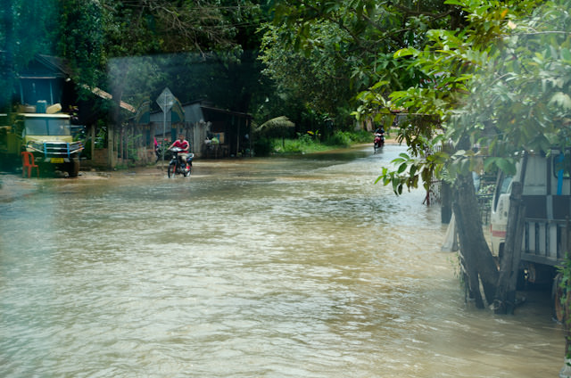 After leaving Siem Reap, we encountered roads that had been washed out by heavy rains in recent days. Photo © 2013 Aaron Saunders