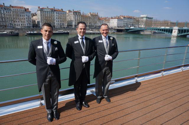 Uniworld's butlers on S.S. Catherine in Lyon, France. © 2014 Ralph Grizzle