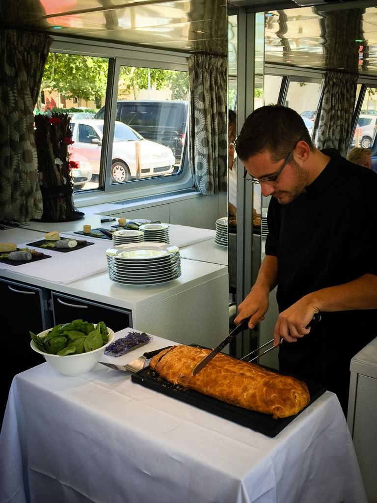 Chef Romain prepares a beautiful salmon dish. © 2015 Ralph Grizzle