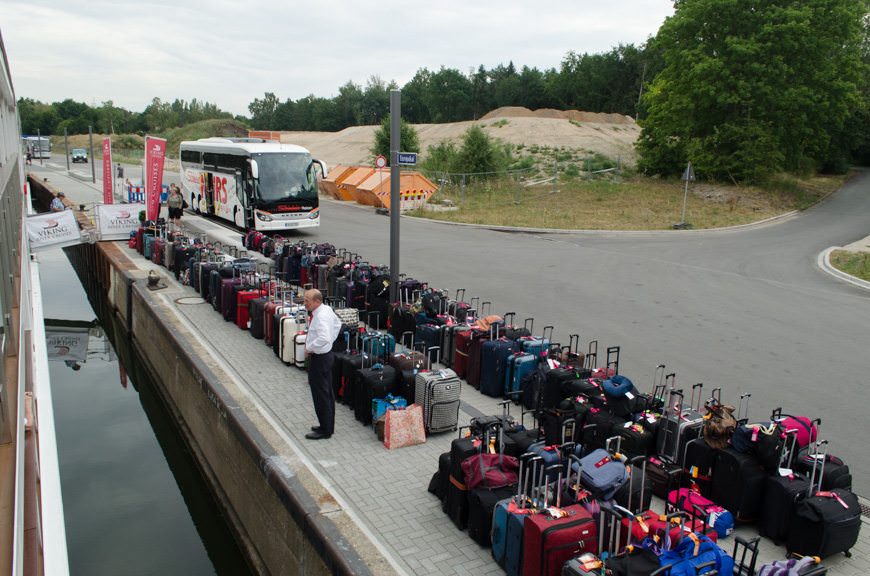 Viking VIdar's Hotel Manager Thomas looks over the sea of luggage that the crew brought off Viking Vidar in order to transfer us to Viking Lofn in Passau to get around a stretch of low water on the Danube. Photo © 2015 Aaron Saunders
