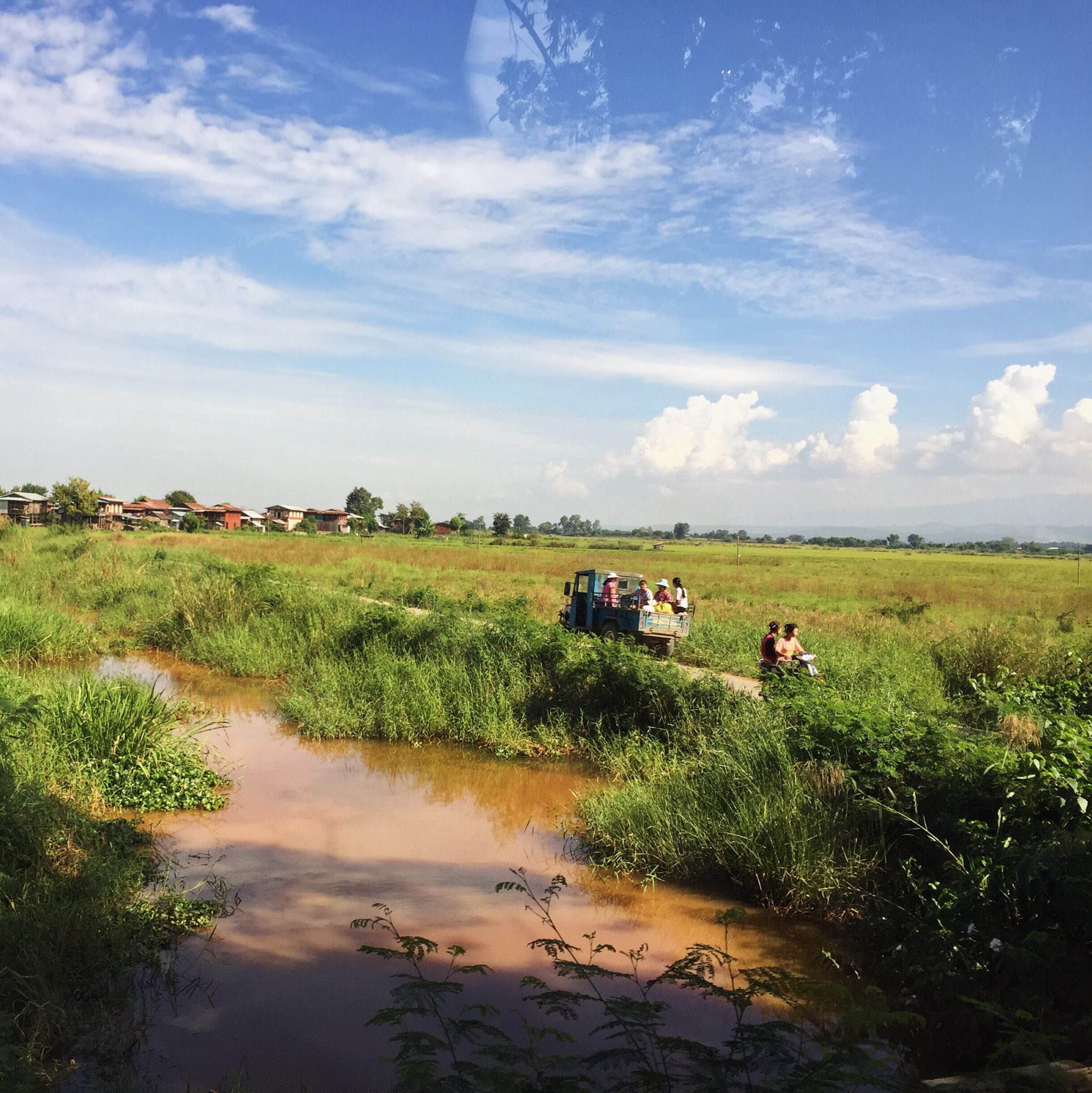 Burmese public transportation makes its way through the countryside. © 2015 Gail Jessen