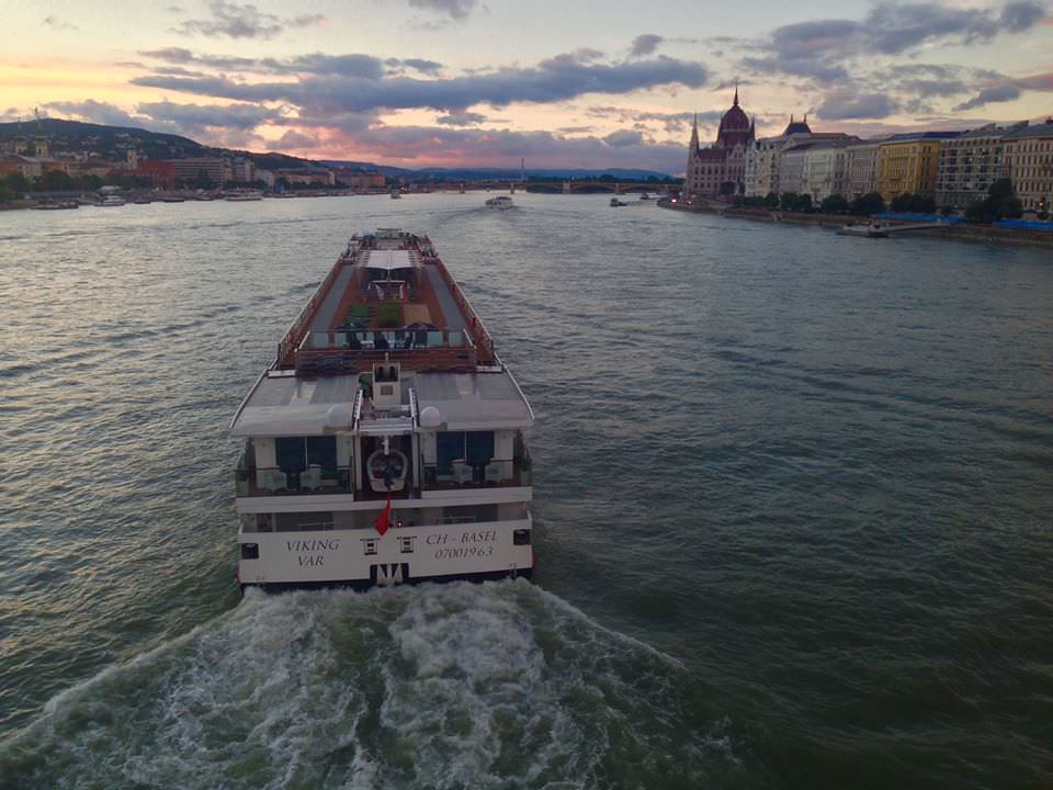 Viking River Cruises' Viking Var sails under the Chain Bridge in Budapest at sunset. Photo © 2016 Aaron Saunders
